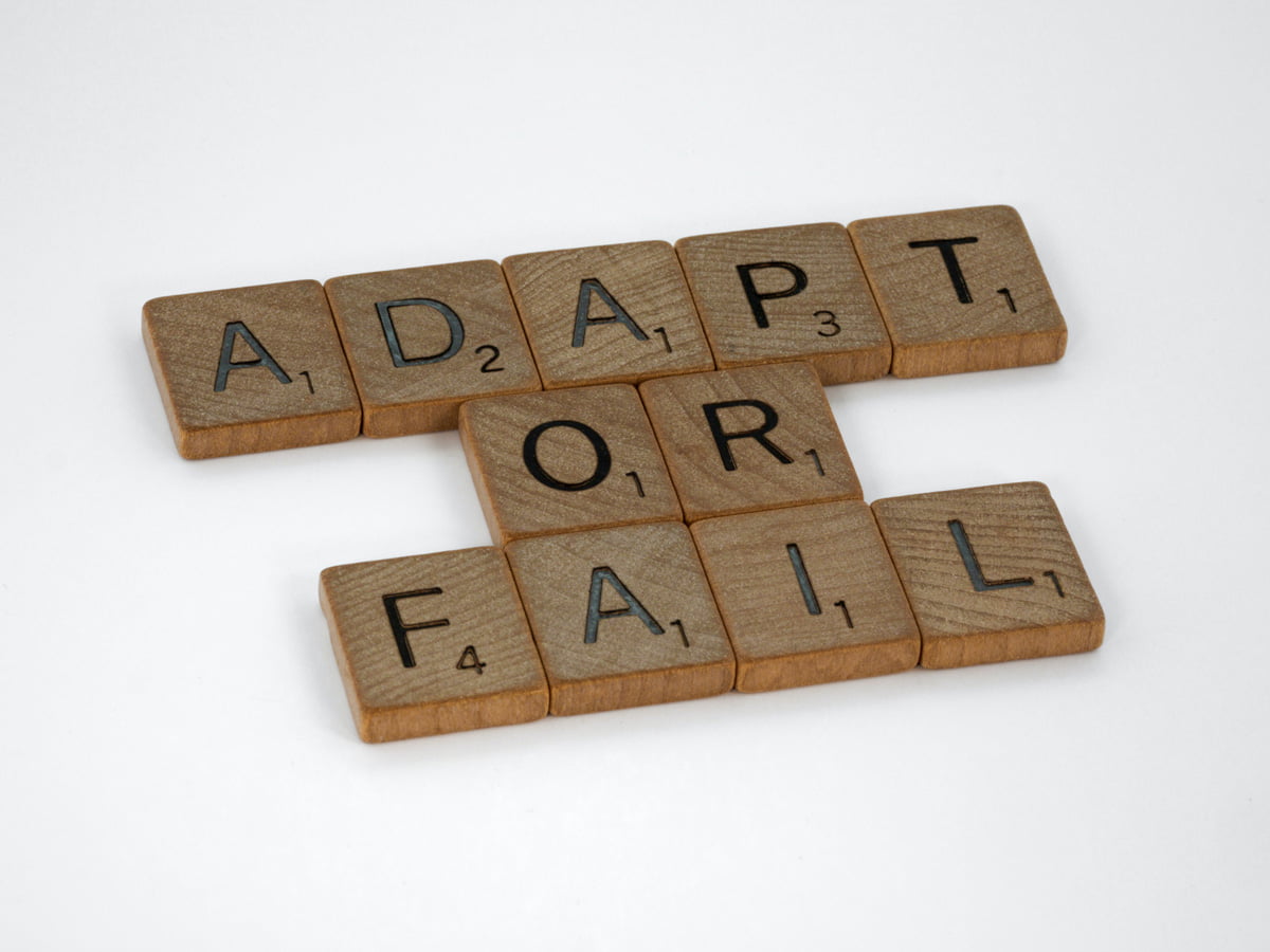 adapt or fail phrase using scrabble letters