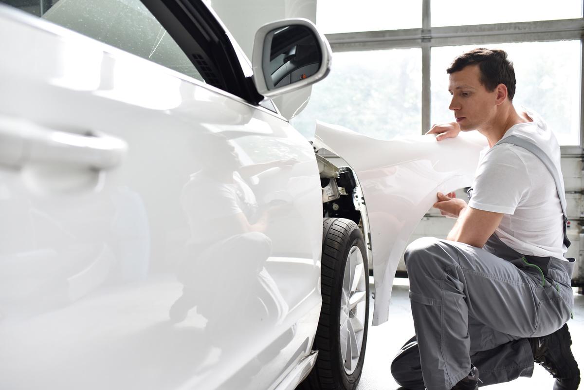 technician ensuring quality during collision repair