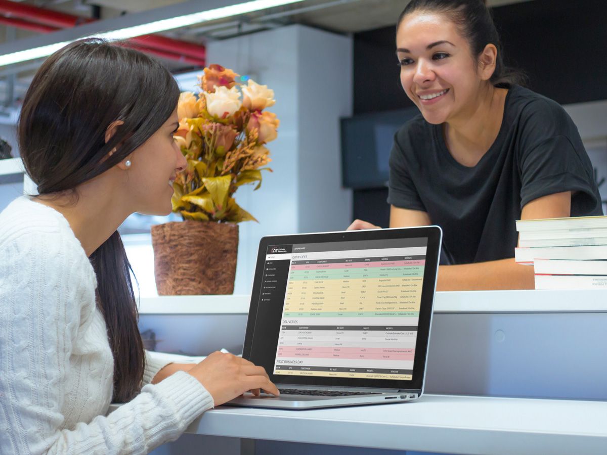 customers using Collision Resources' software at body shop