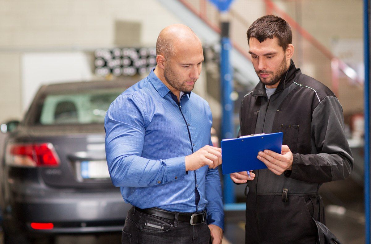 collision repair estimator talking through estimate and repair with customer