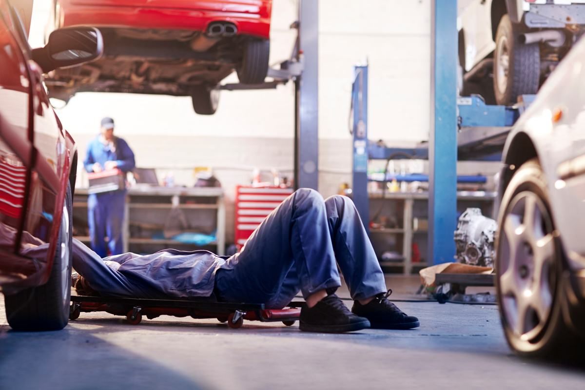 collision repair shop employees working on repair